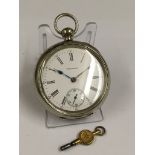 A Vintage pocket watch with key - w/o