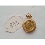 A pretty ladies gold fob watch with enamel floral decoration to back in 9ct - 20.5gms