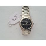 A gents TISSOT PRX wrist watch with seconds sweep & date apperture