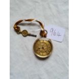 A ladies fob watch in crisps condition in 18ct gold complete with key