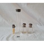 Three silver mounted scent bottles and a hat pin bottle B'ham 1915 etc.