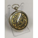 A vintage pocket watch with unusual back case design - working