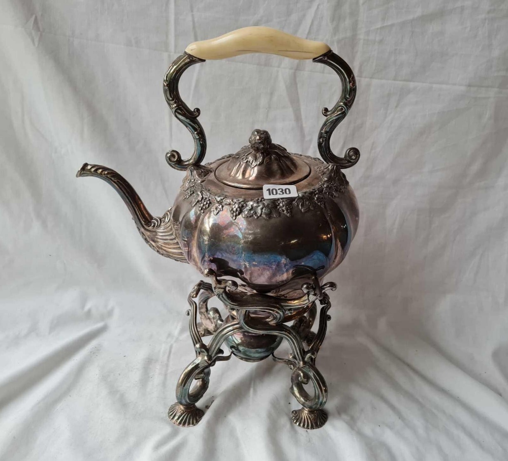 A Victorian spirit kettle on stand with shell feet (one side support inside) 16 inches high