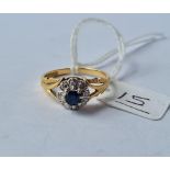 A sapphire & diamond cluster ring in 18ct gold - size Q - 4.1gms