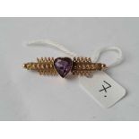 A good fancy bar brooch with large heart amethyst to centre set in gold