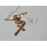 A cross pendant necklace in 9ct - 2.4gms