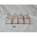 A set of 4 wire work toast racks on ball feet 2 3/4 inches wide B'ham 1913 154 gms