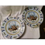 A pair of Delph plates each painted with basket of flowers 13 inches dia