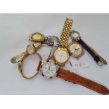 A bag of assorted ladies and gents wrist watches