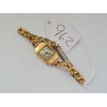 A ladies wrist watch by uno in 9ct with gilt metal strap