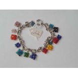 A silver charm bracelet with glass charms