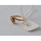 A small 18ct gold and diamond crossover ring size H 2.1g inc