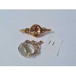 Two gold mounted brooches and a gilt metal spinning fob