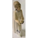 A Lladro figure of girl with candle