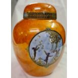 A Carlton ware jar and cover decorated with fairy's 6 1/2 inches high