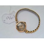 A octagonal ladies wrist watch by ROLEX in 9ct with metal expandable strap