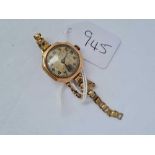 A 1920s ladies wrist watch by ROLEX with seconds dial in 9ct with 9ct strap