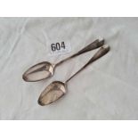 A pair of mid 18th century bottom marked tea spoons by ST?