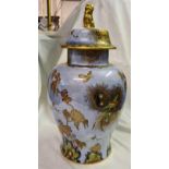 A large Carlton ware jar and cover decorated with birds and exotic plants 14 inches high
