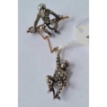 A Edwardian silver and paste double monkey brooch