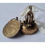 19thc fob seal and a 1908 Mundy 4d coin pendant