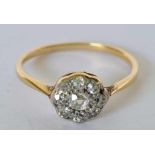 A ANTQUE DAISY DIAMOND CLUSTER RING IN 18CT GOLD AND PLATINUM TOGETHER WITH 1922 RECEIPT SIZE N