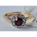 A garnet and white stone cluster ring 9ct size O - 2.6 gms