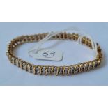 A DIAMOND BRACELET MOUNTED IN 9CT WITH OVER 1CT OF DIAMONDS 13.8g inc