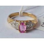 A pink sapphire ring set with diamond shoulders size N 2.3g inc