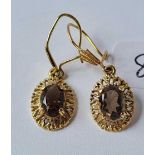 A pair of 9ct smoky quartz drop earrings