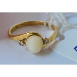 A pearl and diamond ring 18ct gold size J - 2.1 gms