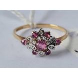 A ruby and diamond cluster ring in 9ct size M