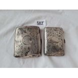 Two cigarette cases, one scroll engraved - Birmingham 1929 - total weight 138 g.