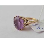 A purple stone dress ring 9ct size M - 5.7 gms