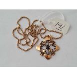 A floral stone set 9ct pendant on 9ct chain 4.7g inc