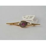 A good 18ct gold mounted diamond and ruby bar brooch 5.2g inc