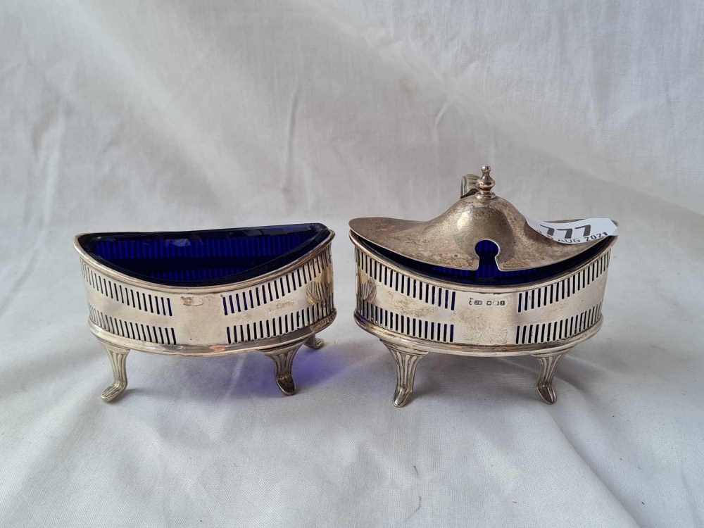 A Georgian style oval boat shaped mustard pot and matching salt with pierced sides, Sheffield