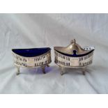 A Georgian style oval boat shaped mustard pot and matching salt with pierced sides, Sheffield