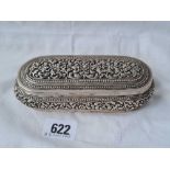 A middle eastern chased oval box with hinge cover 6 inches long - 179 gms