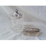 A cut glass jam jar with silver cover and a dressing table jar.