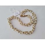 A four row pearl necklace 9ct clasp