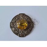 A Scottish Glasgow Celtic style silver brooch with large citrine to centre