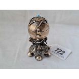 A foreign silver pepper with lion decorated stem, turquoise inset pierced cover dated 1873, 2.3/4”