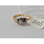 A three stone diamond twist ring in 18ct gold size H 2.2g inc