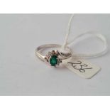 An emerald & diamond ring in 14ct white gold mount size R 3.1g inc