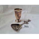 A Dutch caddy spoon with embossed shovel bowl & a foreign silver beaker