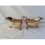 An attractive pair of Georgian style candle sticks with Gadroon rims, shell feet, 6.5” long,