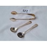 A small pair of sugar tongs B'ham 1887 and two sterling salts spoons