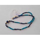 A silver and lapis bead necklace with 9ct clasp