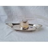 A good boat shaped ink stand with mounted ink pot and four scroll feet 10 inches long Sheffield 1901